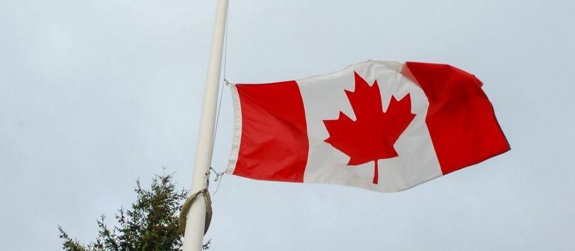 Canadian flag flying at half-mast